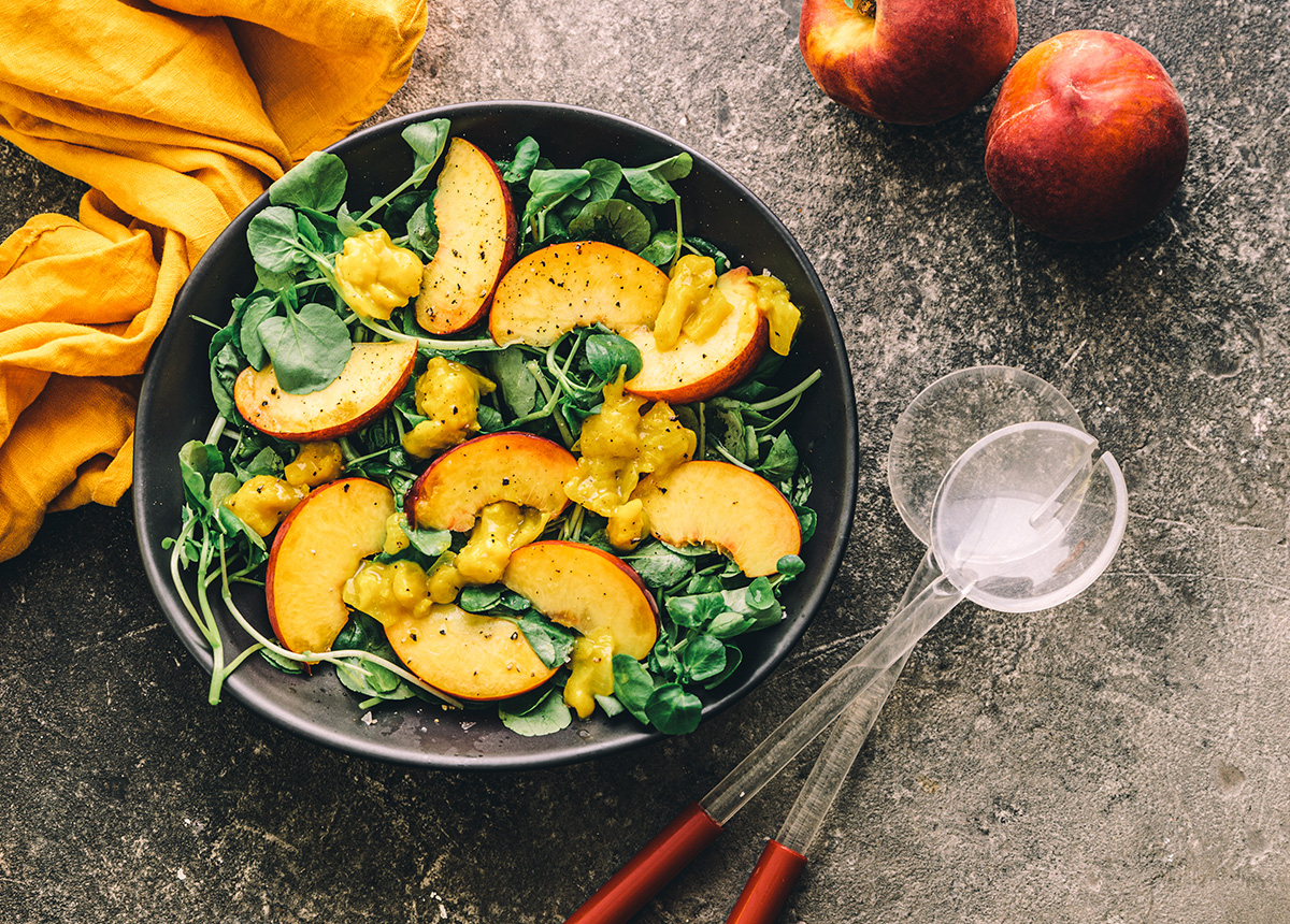 Colourful and deliious looking peach salad i a bowl