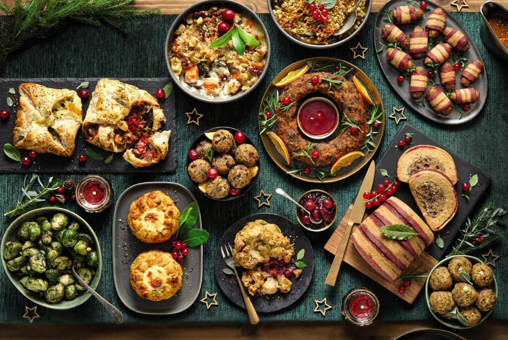 An overhead image of a Christmas spread of vegan food.