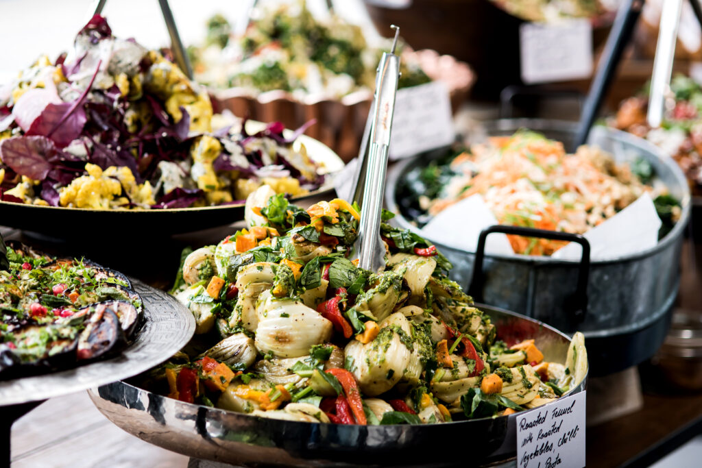 An image of assorted salads in a buffet