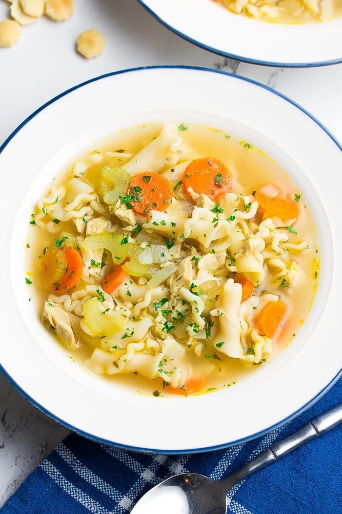 Overhead image of a vegan 'chicken' and noodles in a broth-style soup.