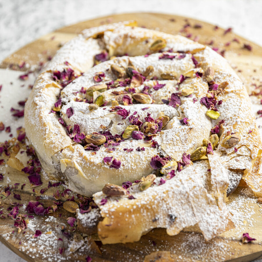 Delicious roll up with pistachio nut and rose petals on top
